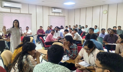 Teachers perform music together during a professional development event at AKA Hyderabad.